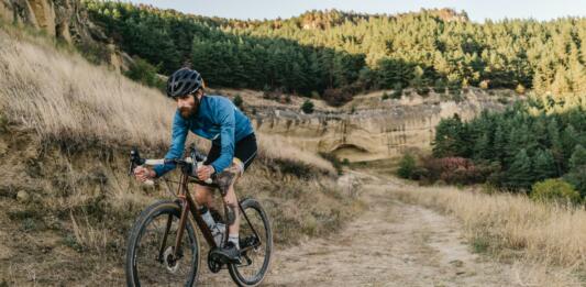 Man cyclist riding road gravel bike