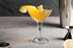 Sidecar Cocktail boozy brandy, Cointreau orange liqueur and fresh lemon juice and garnish with lemon peel