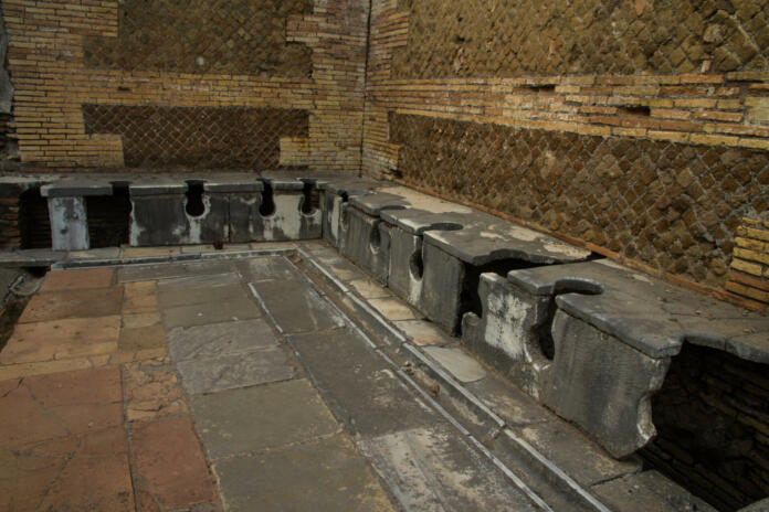 Roman public lavatories,  at Ostia Antica, roman city. Rome in Italy.