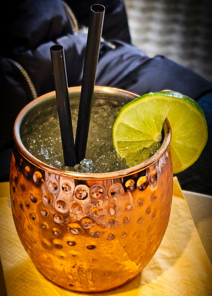A Moscow mule is a cocktail made with vodka, ginger beer, and lime juice, garnished with a slice or wedge of lime and a sprig of mint. The drink, being a type of buck, is sometimes called buck vodka. It is commonly served in a copper cup, which takes on the cool temperature of the liquid