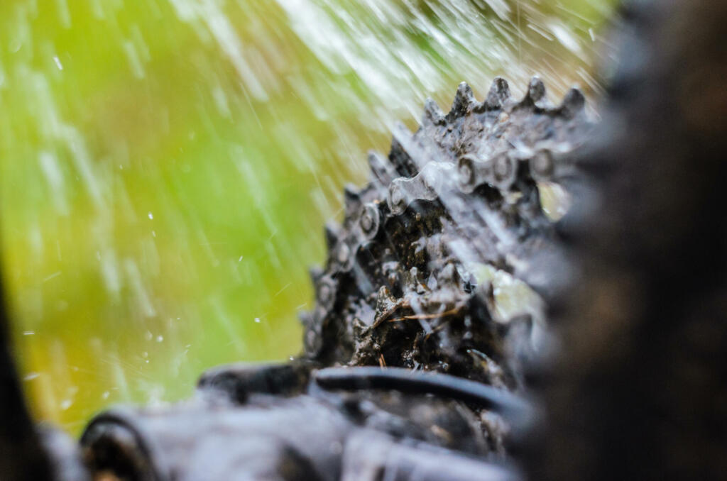 Washing the Transmission of a Mountain Bike with a Water Jet, Close-Up.