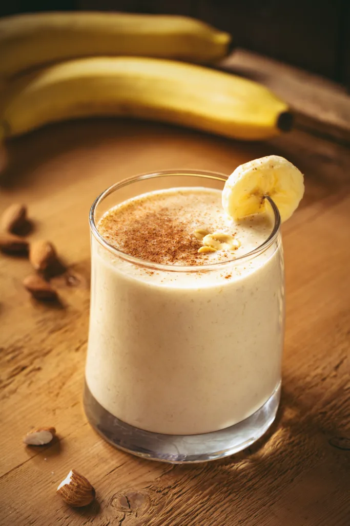 Banana smoothie / banana milkshake with cinnamon and peanuts