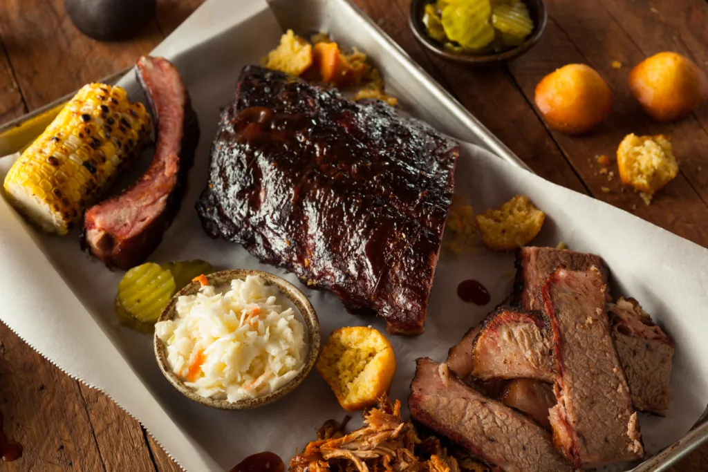 Barbecue Smoked Brisket and Ribs Platter with Pulled Pork and Sides