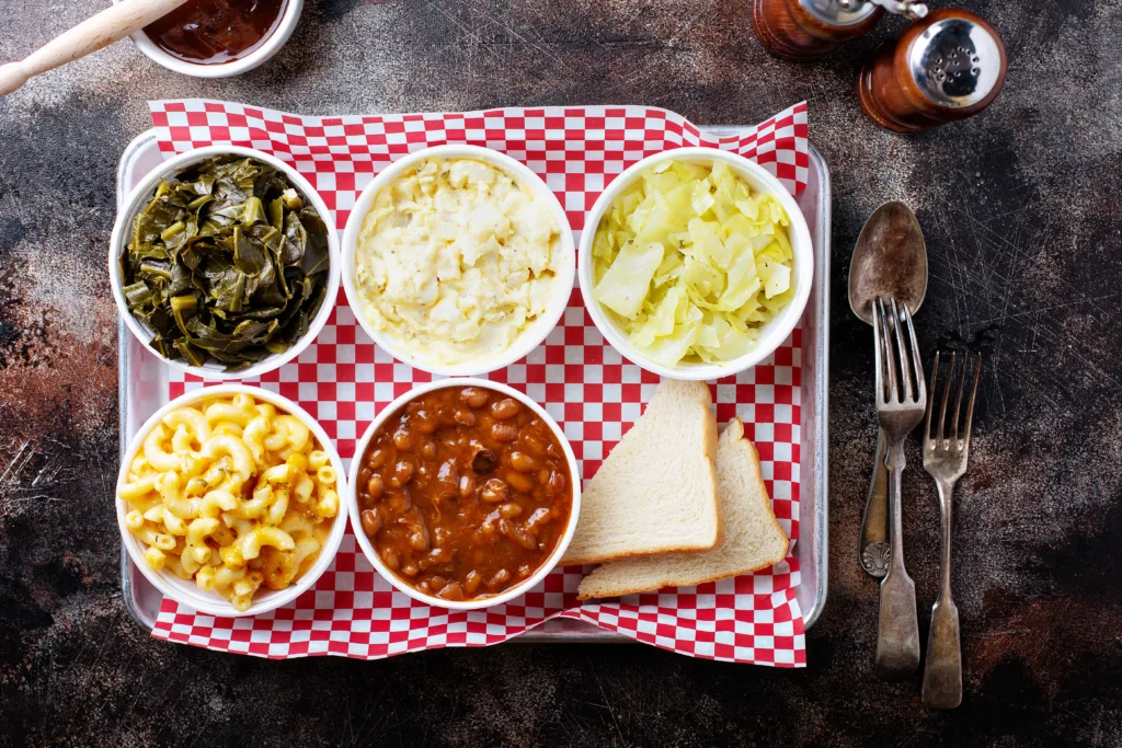 Classic southern bbq sides with beans, cole slaw, mac and cheese and collard greens