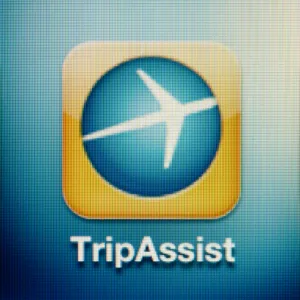 "Kyiv, Ukraine - March 25, 2012: Close-up of the TripAssist application icon on the screen of the iPhone 4."