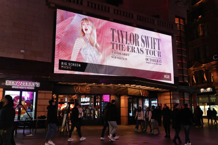 London England UK - October 2023: Vue Cinema London - West End (Leicester Square) is advertising The cultural phenomenon "Taylor Swift: The Eras Tour" concert & musical movie in central London, UK. 

Location: Leicester Square is a pedestrianised square in the West End of London, England. Cranbourn Street, London: "Taylor Swift: The Eras Tour" Concert Movie Poster, Vue Cinema London - West End (Leicester Square) Central London, West End of London, England, United Kingdom, Britain Europe...