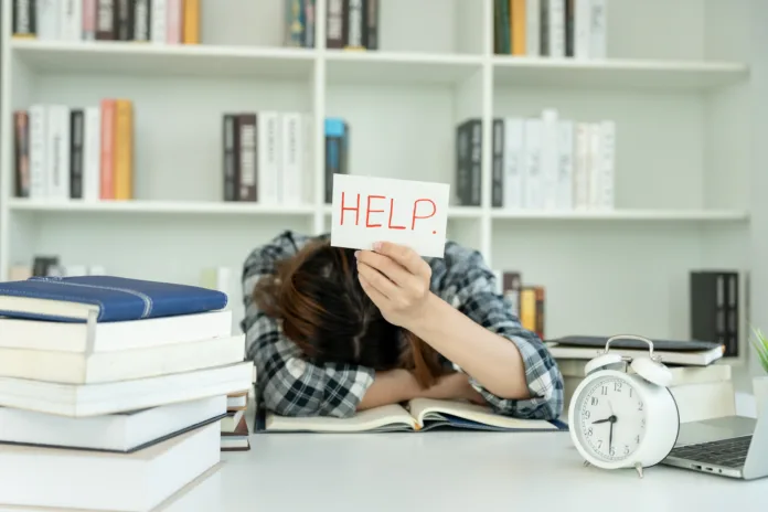 Asian student man have anxiety because of exams, male prepare for test and learning lessons in the library. stress, despair, haste, misunderstanding reading, discouraged, expectation, knowledge, tired