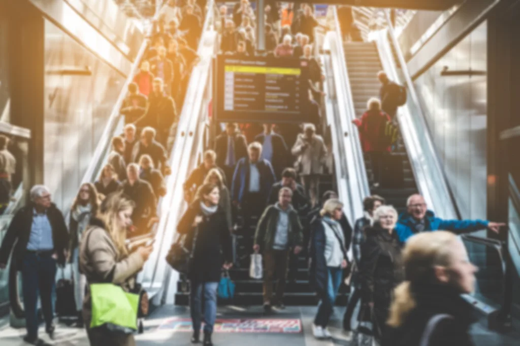 Berlin, Germany - april, 27: Traveling people on crowded escalator inside main train station (Hauptbahnhof) in Berlin.