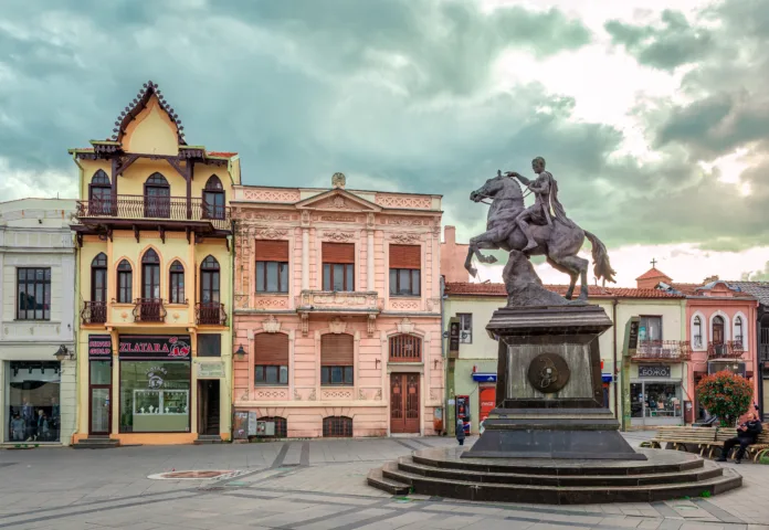 Bitola, North Macedonia - March 17 2024: Magnolia Square which intersects with Shirok Sokak pedestrian street, with the Philip II of Macedon statue and the building of the Russian Consulate in the background.