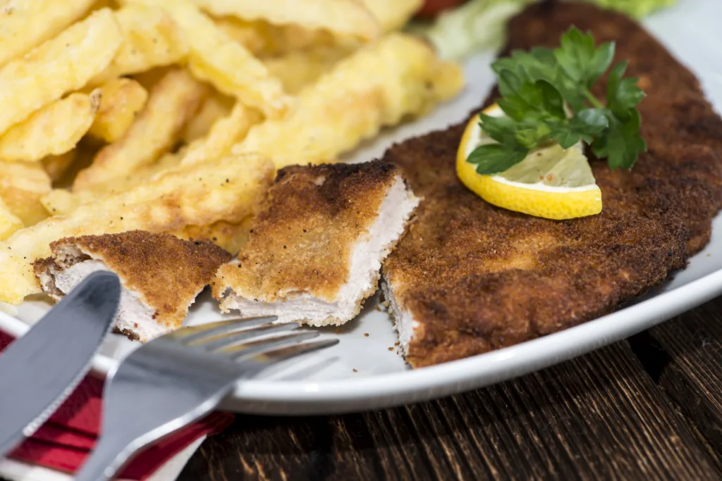 Fresh made Schnitzel with Chips on a plate