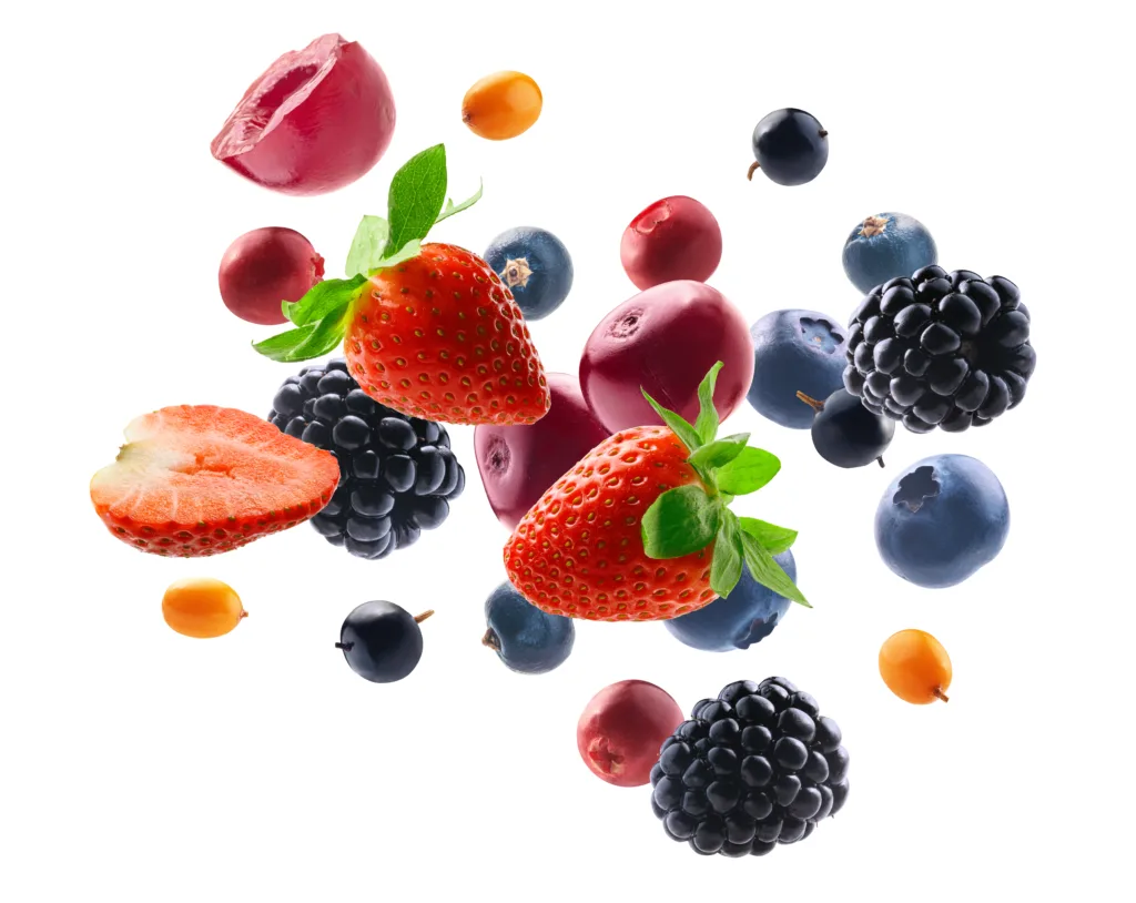 Many different berries in the form of a frame on a white background.