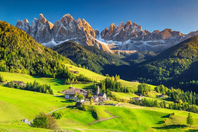 Famous best alpine place of the world, Santa Maddalena village with magical Dolomites mountains in background, Val di Funes valley, Trentino Alto Adige region, Italy, Europe