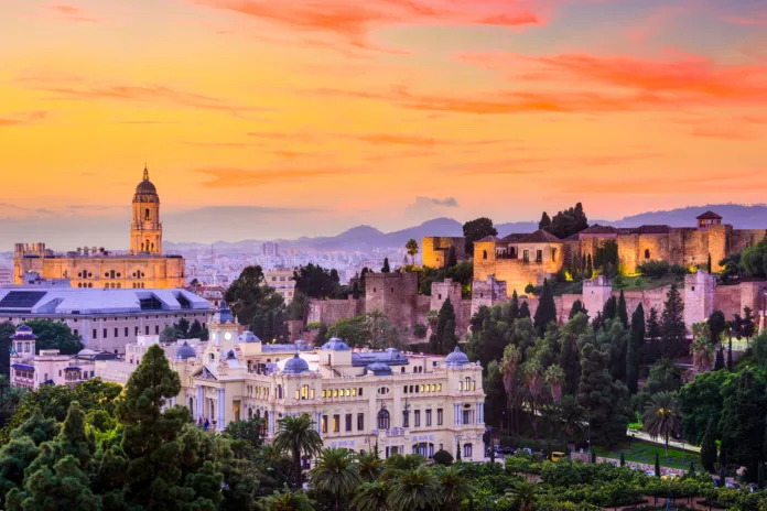 Malaga, Spain cityscape at the Cathedral, City Hall and Alcazaba citadel of Malaga.