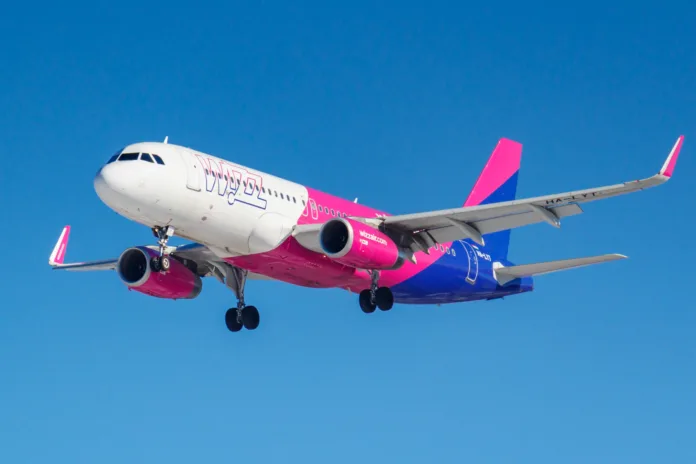 Moscow, Russia - March 26, 2019: Aircraft Airbus A320-232(WL) HA-LYT of Wizz Air against blue sky in sunny morning going to landing at Vnukovo international airport in Moscow