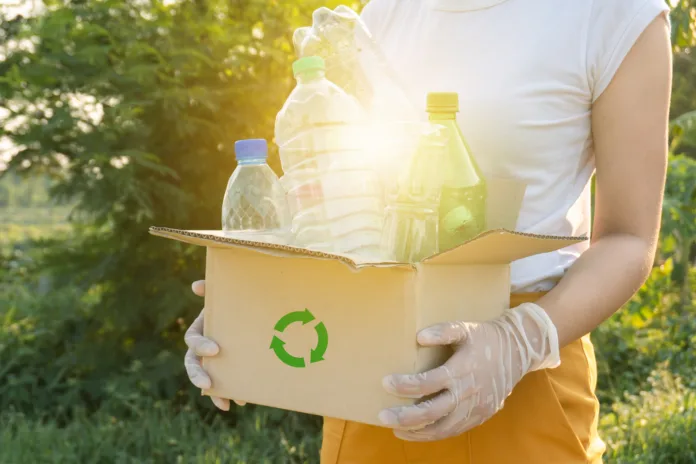 plastic bottles into a box for recycling concept