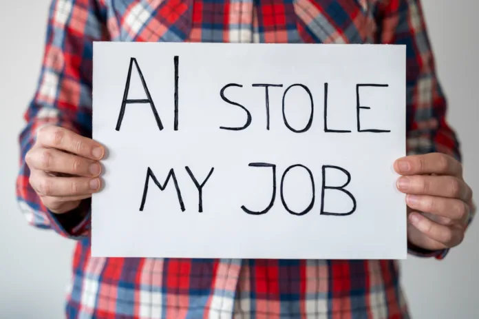 Anonymous person holding sign with inscription "AI stole my job". They have sense of loss and helplessness in face of technological advancements reshaping workforce