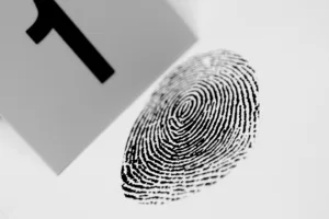 Black fingerprint with a crime scene marker