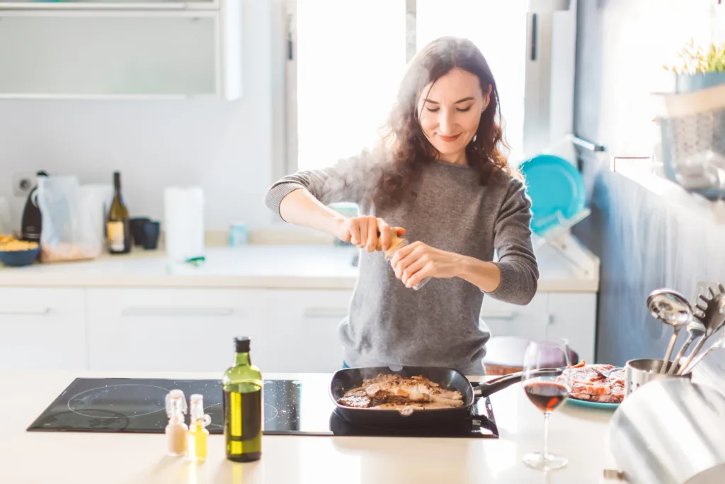 Picture of woman grilling meat