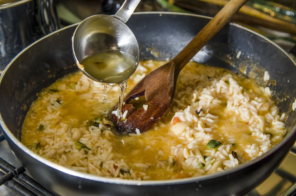 Risotto with seafood in cooking