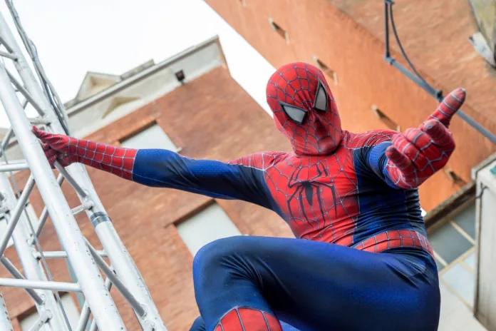 A man cosplaying the famous Marvel comic character, Spiderman during the Carnival Parade along the way of City of Gaeta, Lazio, Italy, February 2019