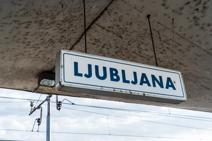 Blue and white Ljubljana post in a platform at Ljubljana train station in Slovenia