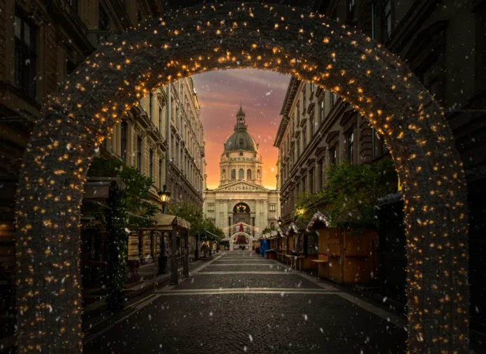 Christmas market at Saint Stephen Basilica in Budapest, with festive lights and holiday charm,  Hungary