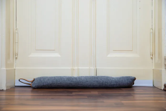 Draft Excluder Under Door Blocking Cold Air From Traveling Around