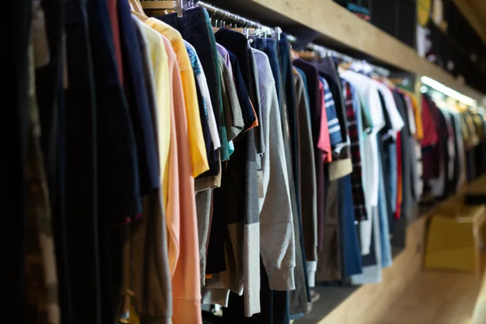 Male clothes on hangers in apparel boutique