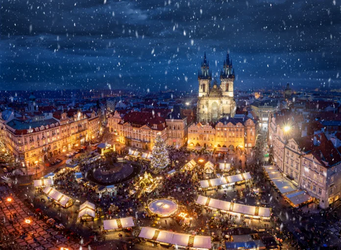 View of the old town square of Prague, Czech Republic, during winter time with the traditional Christmas Market under snow