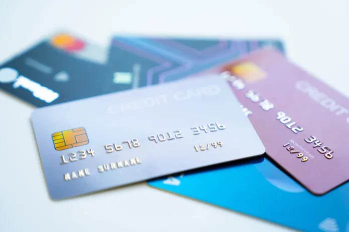 Credit cards stacked on white background