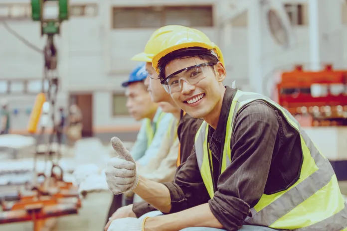 Heavy Industry Worker workman service team working in metal factory Portrait Happy smiling.