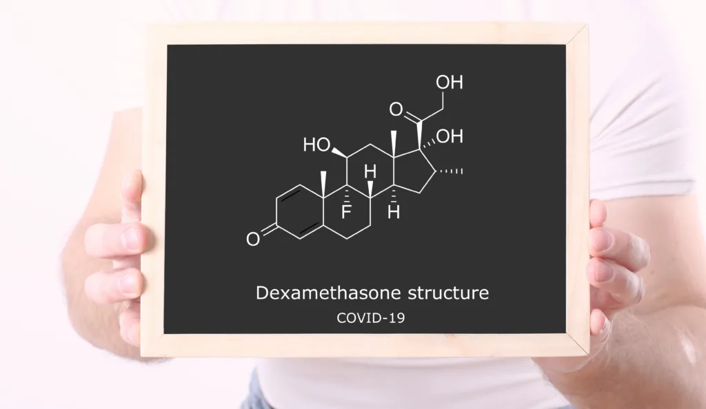 The structure of dexamethasone is shown on a black board.