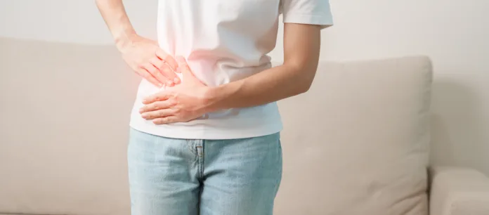 Woman having abdomen pain on the sofa at home. Liver cancer and Tumor, kidney cancer, Jaundice, Viral Hepatitis, Cirrhosis, Failure, Enlarged, Hepatic Encephalopathy, Stomach and health concept