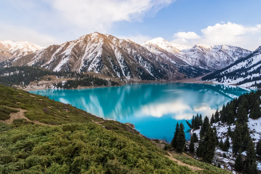 A scenic view of the Big Almaty Lake with Tianshan Mountains in Kazakhstan near the city of Almaty