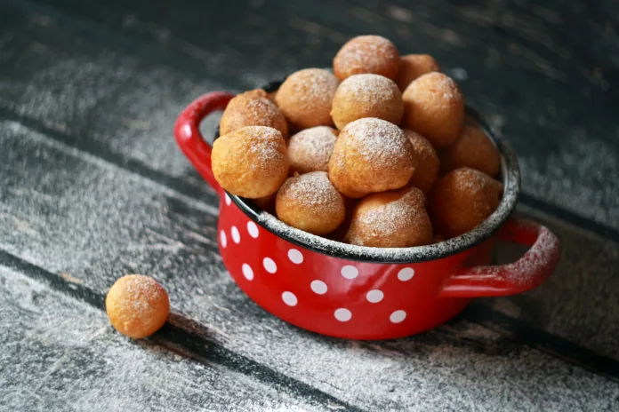 Fritule - Croatian mini doughnuts. Selective focus