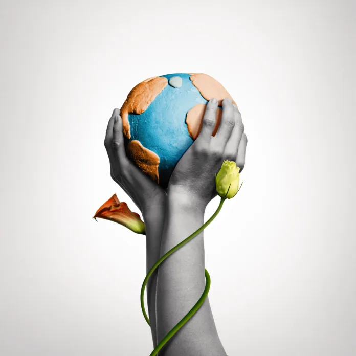 Two hands hold the planet Earth. Art collage.