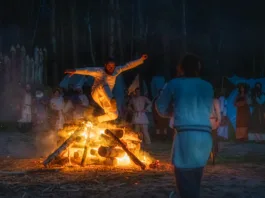 Cedynia, Poland, June 2019 Pagan reenactment of Kupala Night, called in Poland Noc Kupaly, man showing his bravery is jumping over bonfire. Slavic holiday celebrated on the shortest night of the year