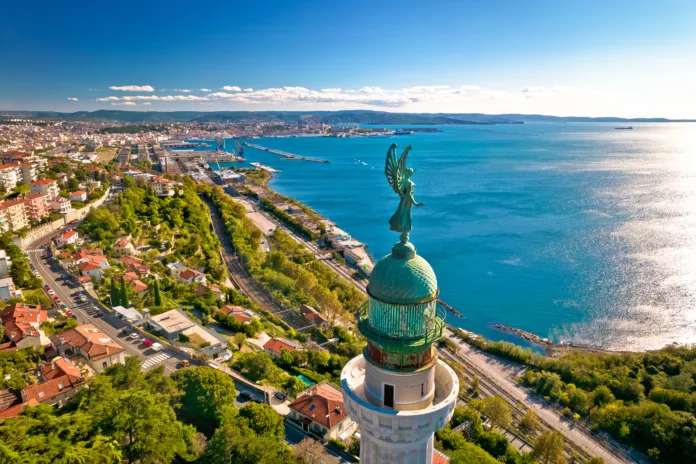 Trieste lighthouse Phare de la Victoire and cityscape panoramic aerial view, Friuli Venezia Giulia region of Italy